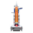 Front view of the CaDA SLS Artemis C56049W orange rocket and white boosters above the launch base