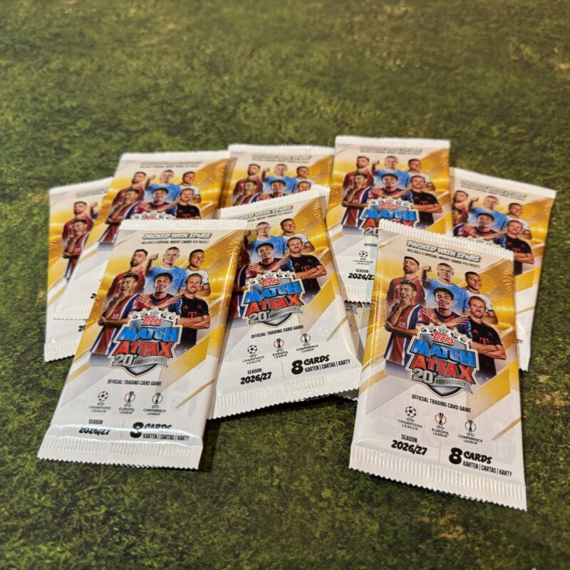 Topps Match Attax 2026/27 card packets arranged on grass