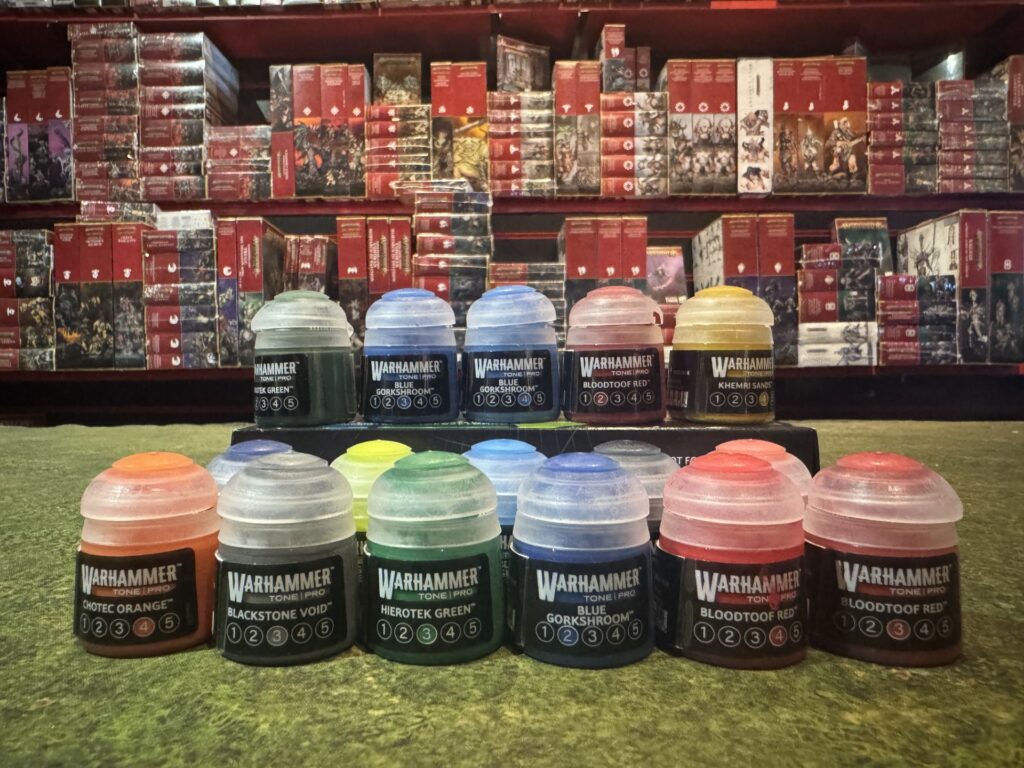A selection of Warhammer Tone Pro paint pots displayed at Bomran
