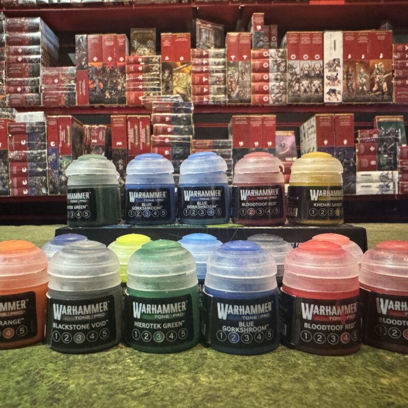 A selection of Warhammer Tone Pro paint pots displayed at Bomran